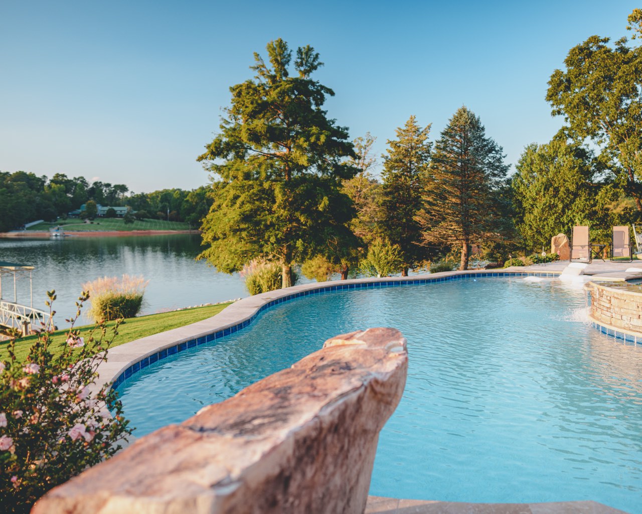 Lakefront Pool With Natural Boulder Accent