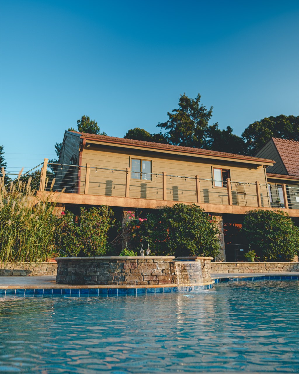 Pool Water Feature Below Elevated Cable Rail Deck