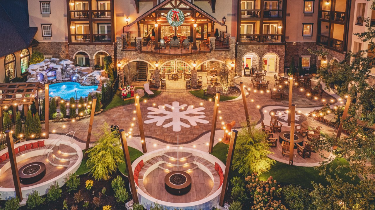 Aerial Snowflake Paver Plaza With Fire Pit Lounges At Twilight