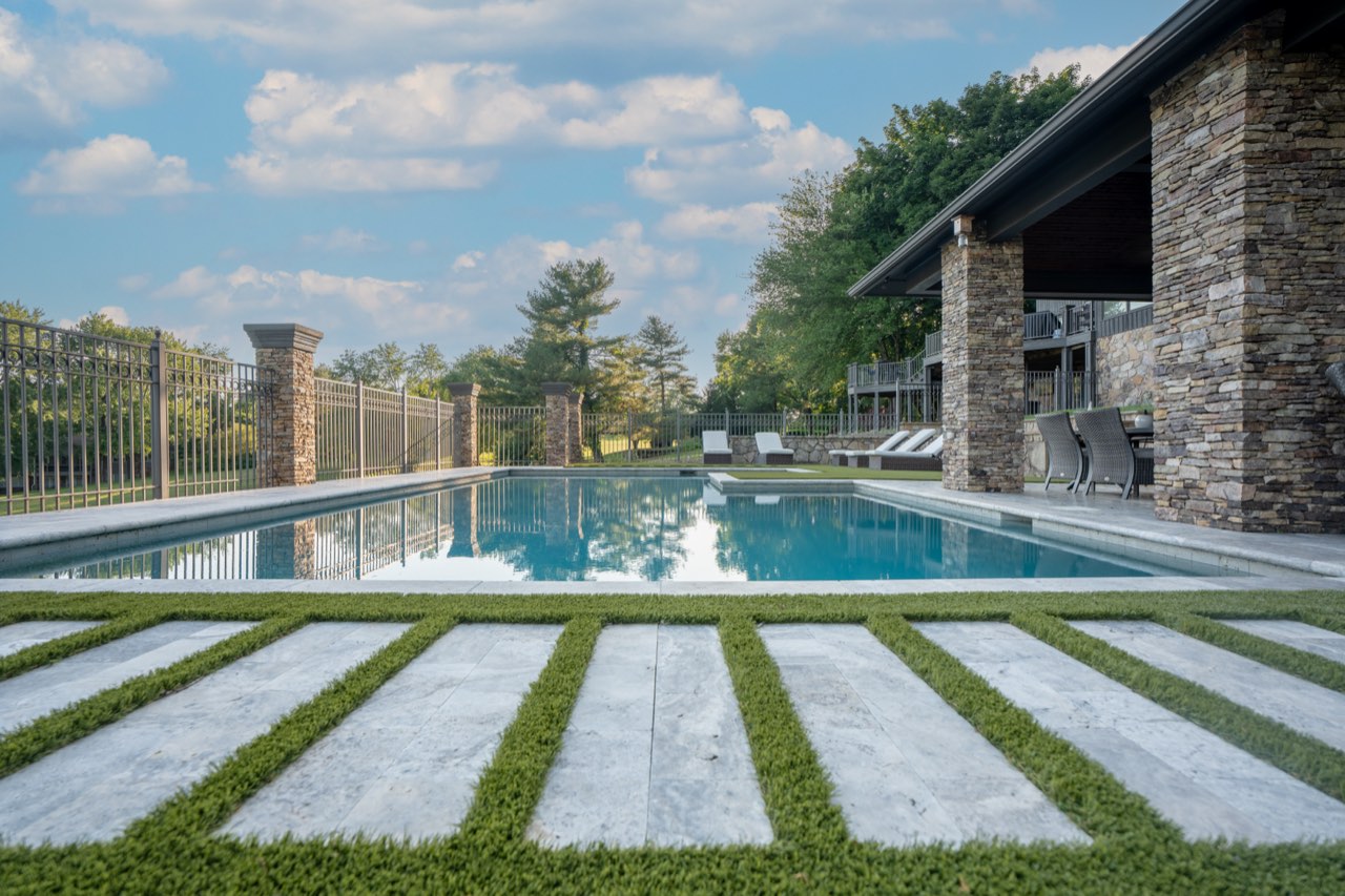Travertine & Turf Pool Deck With Stone Pavilion
