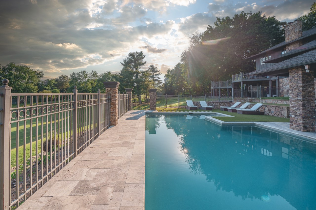 Travertine Pool Deck With Sunburst Over Pavilion