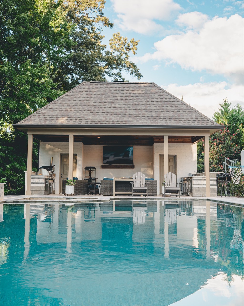 Gunite Pool Mirroring Covered Poolside Pavilion