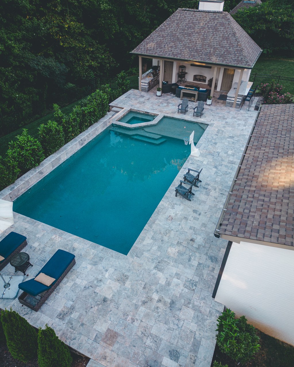 Aerial Pool, Spa & Travertine Patio With Pavilion at Dusk