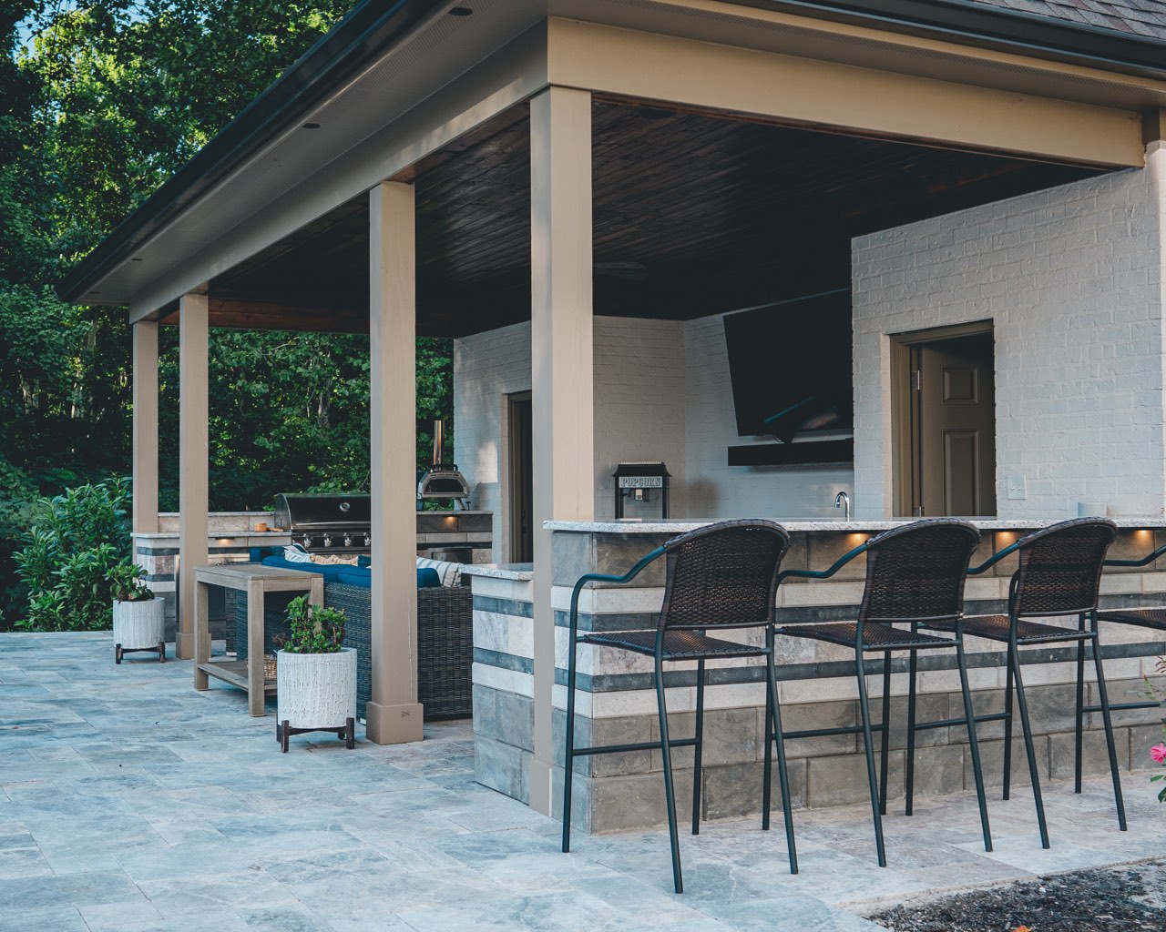 Covered Outdoor Kitchen With Stone Bar, Grill and Pizza Oven