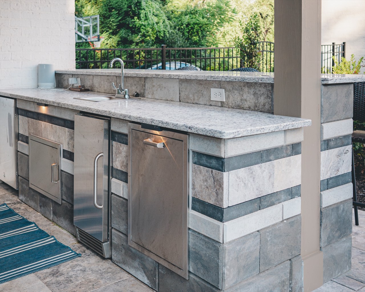Granite-Topped Outdoor Kitchen Island With Stainless Appliances