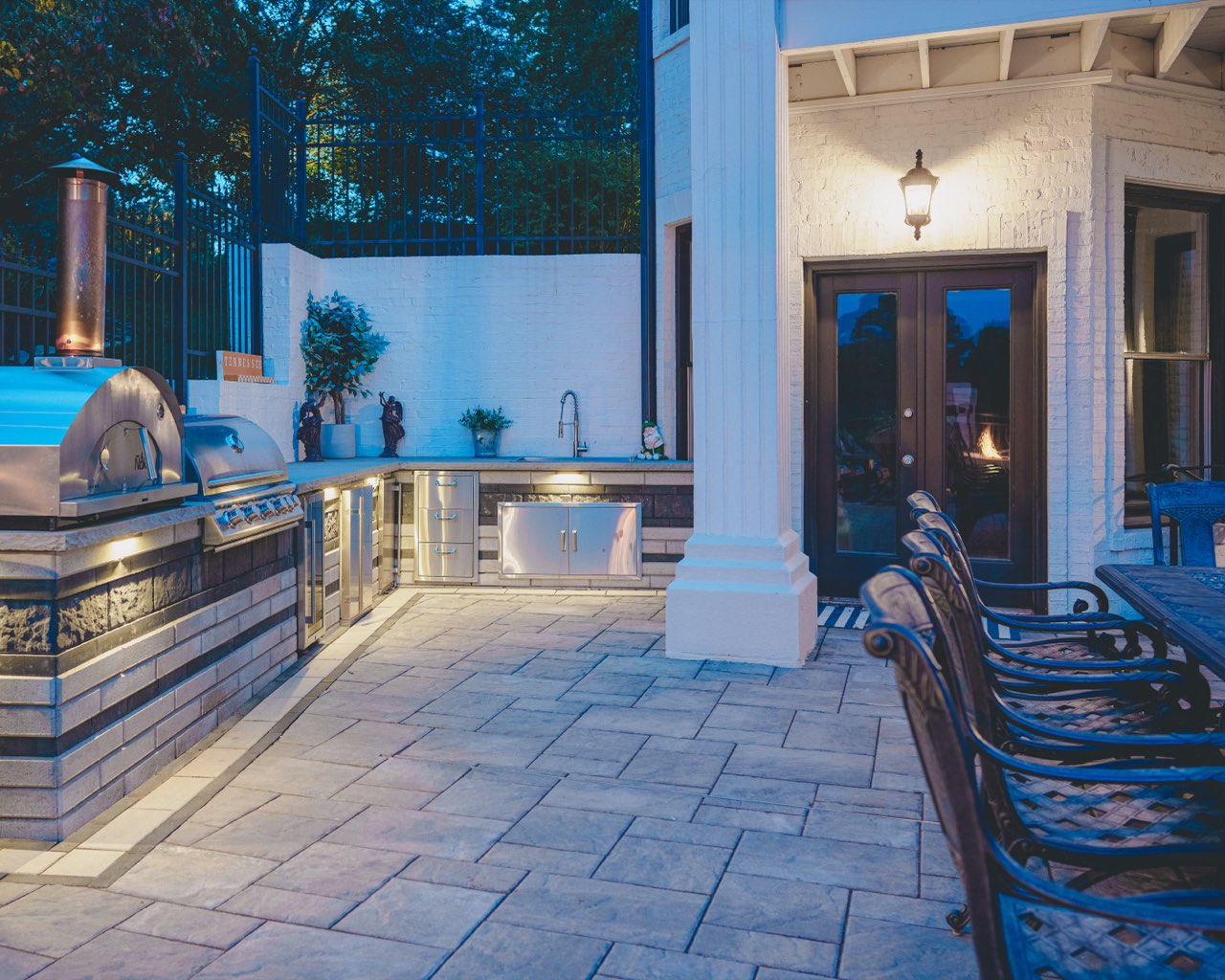 Covered Outdoor Kitchen With Grill, Pizza Oven & Travertine Deck