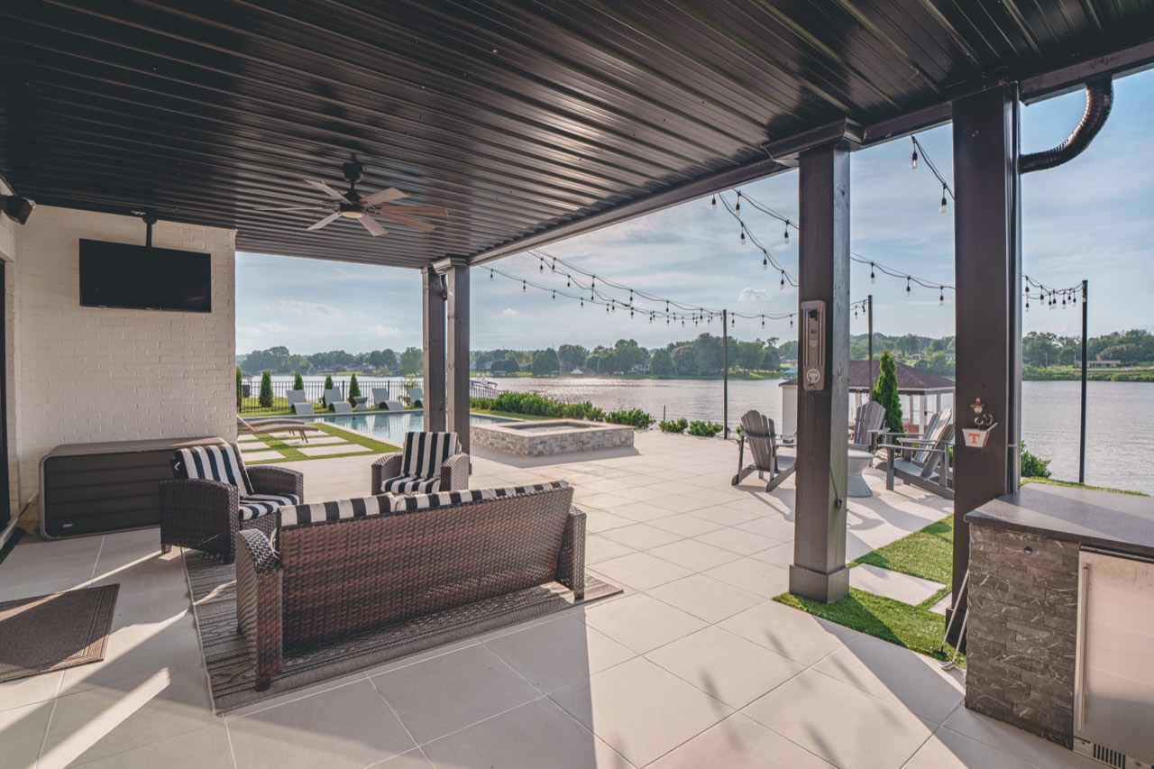 Covered Outdoor Living Lounge Overlooking Pool & Lake