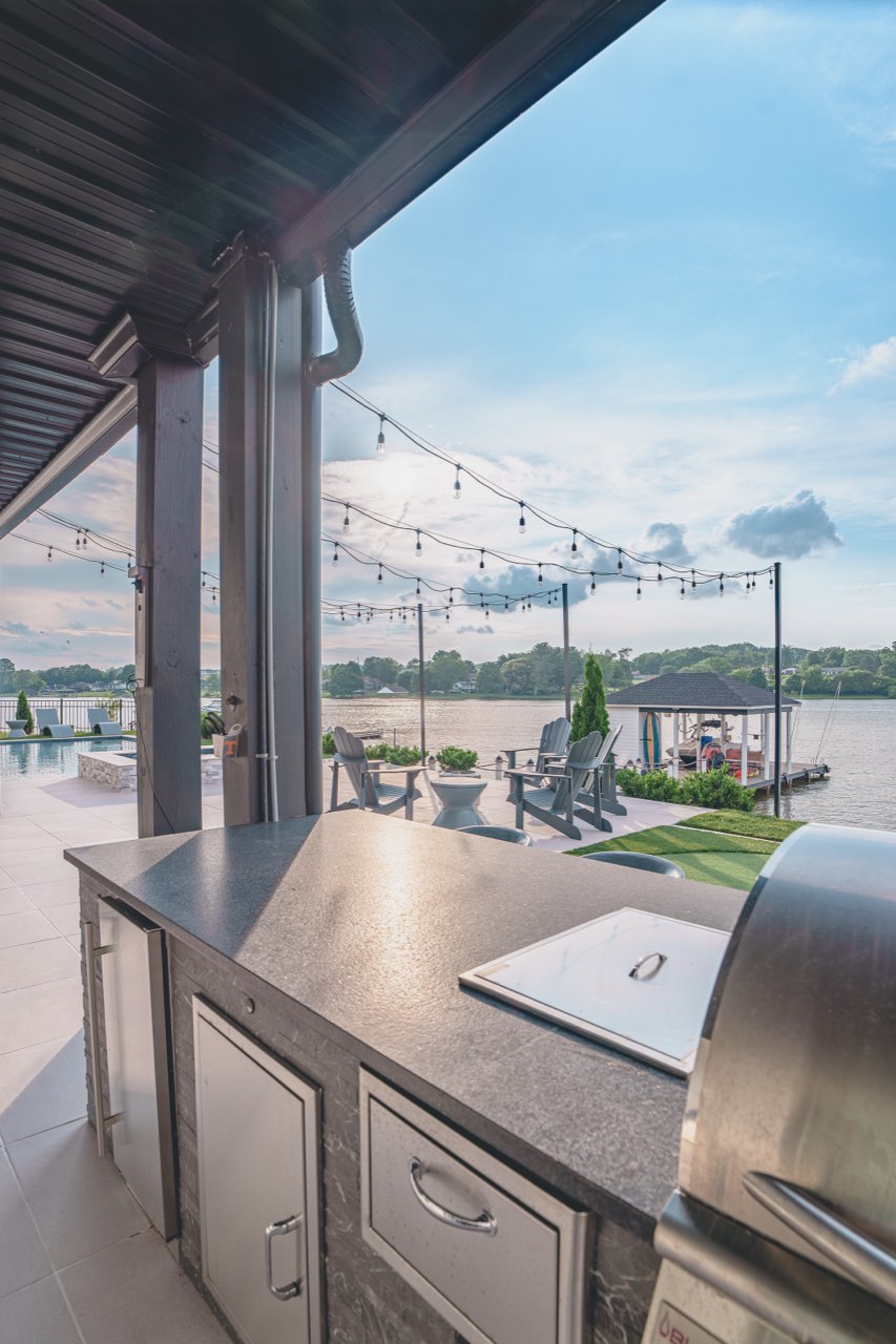 Stainless Outdoor Kitchen With Lake View & String Lights
