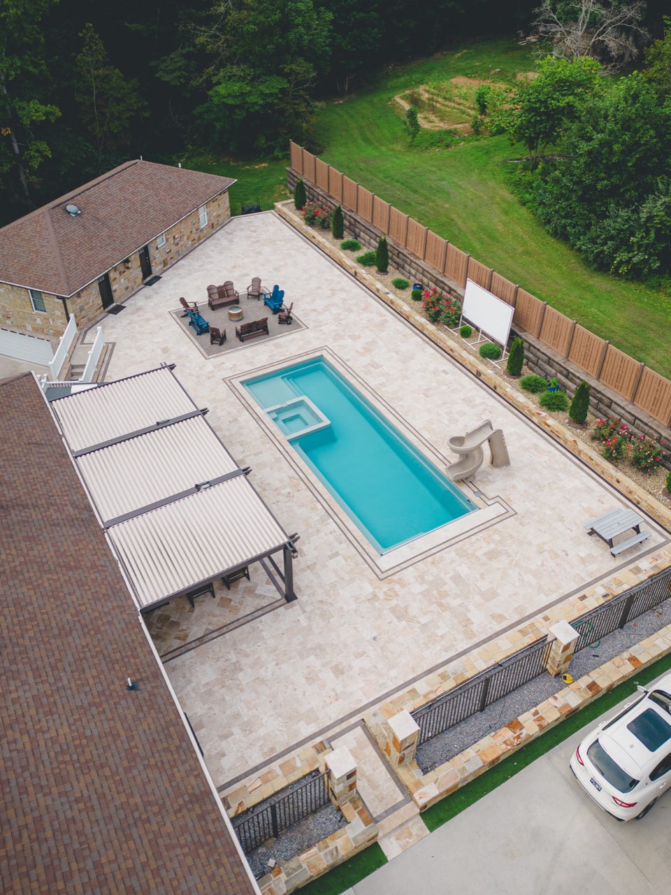 Aerial Gunite Pool, Raised Spa, Slide & Travertine Deck