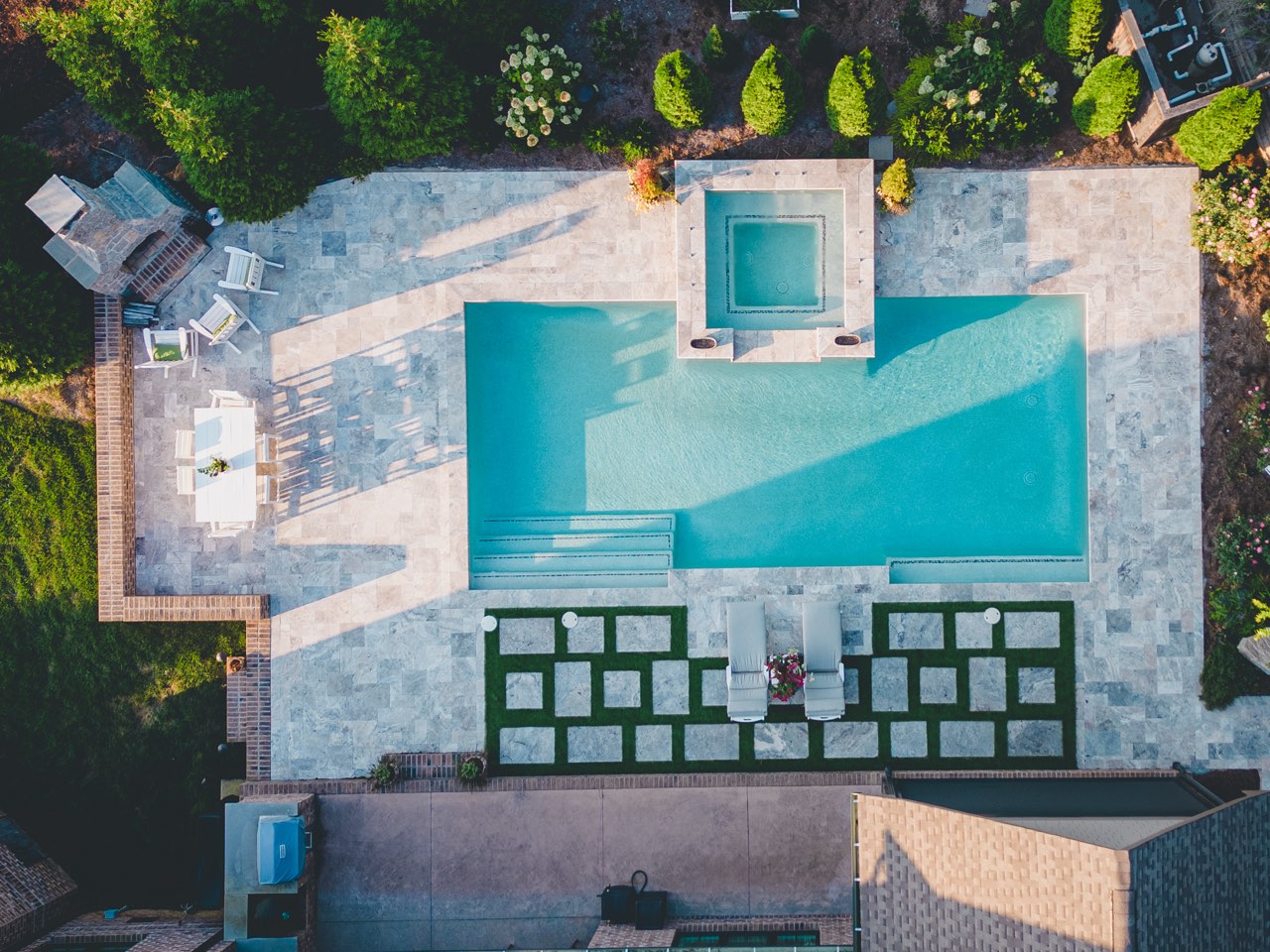 Aerial Geometric Pool, Raised Spa & Travertine Deck With Turf Inlays
