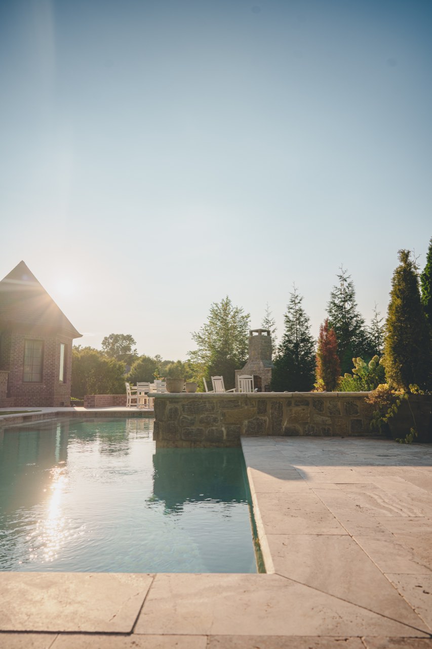 Travertine Pool Deck & Stone Wall at Golden Hour